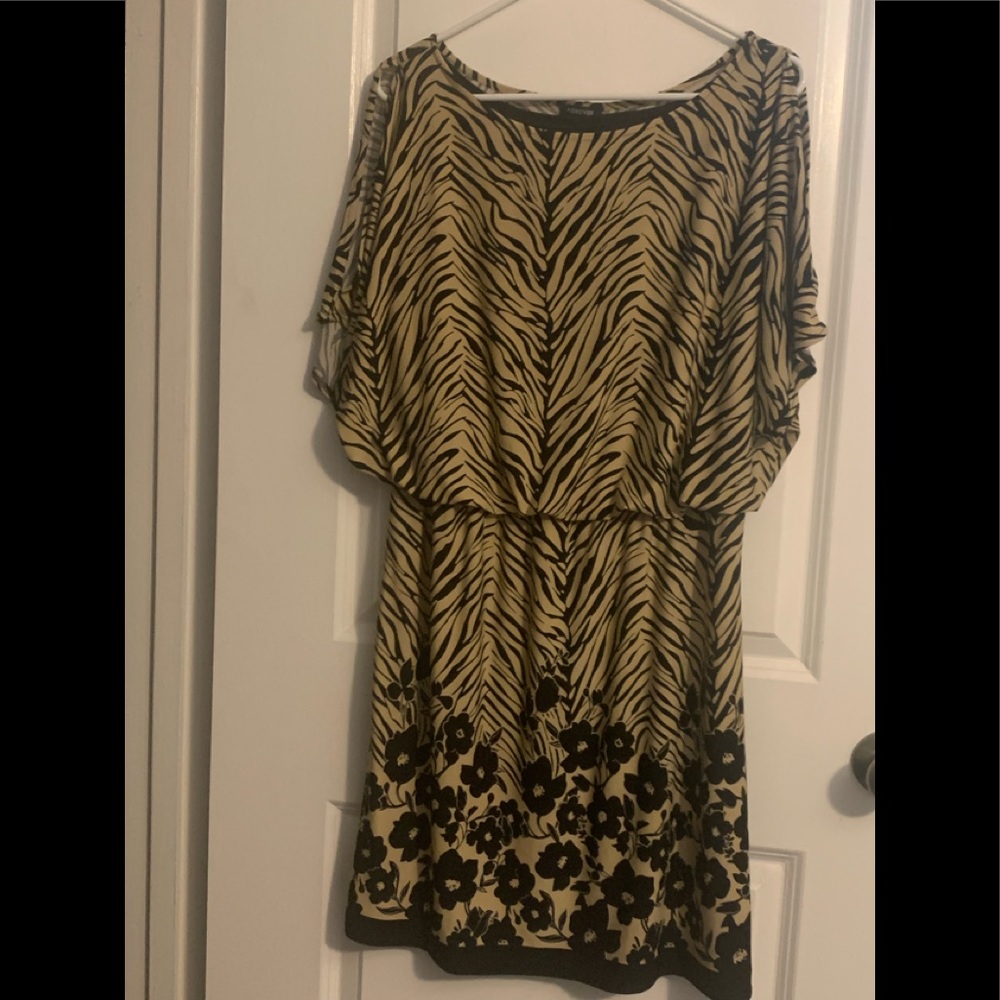 Dress size L in tan and black zebra print with floral trim at the bottom